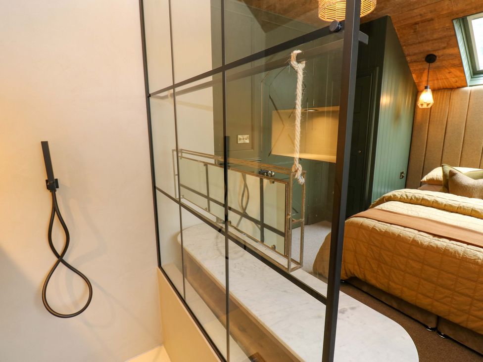 A bedroom with a shower area and marble surface at White House in Durham