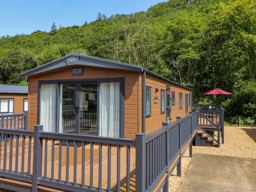 A mobile home with deck and stairs at The Beaumont No 34 New Quay