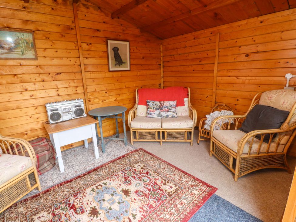 A snug with seating and a boombox at 2 Llainwen Ty Croes