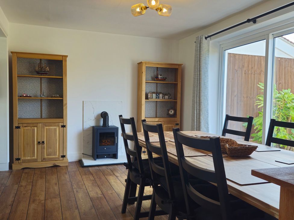 A dining room with a table and chairs at The Warren in Seahouses