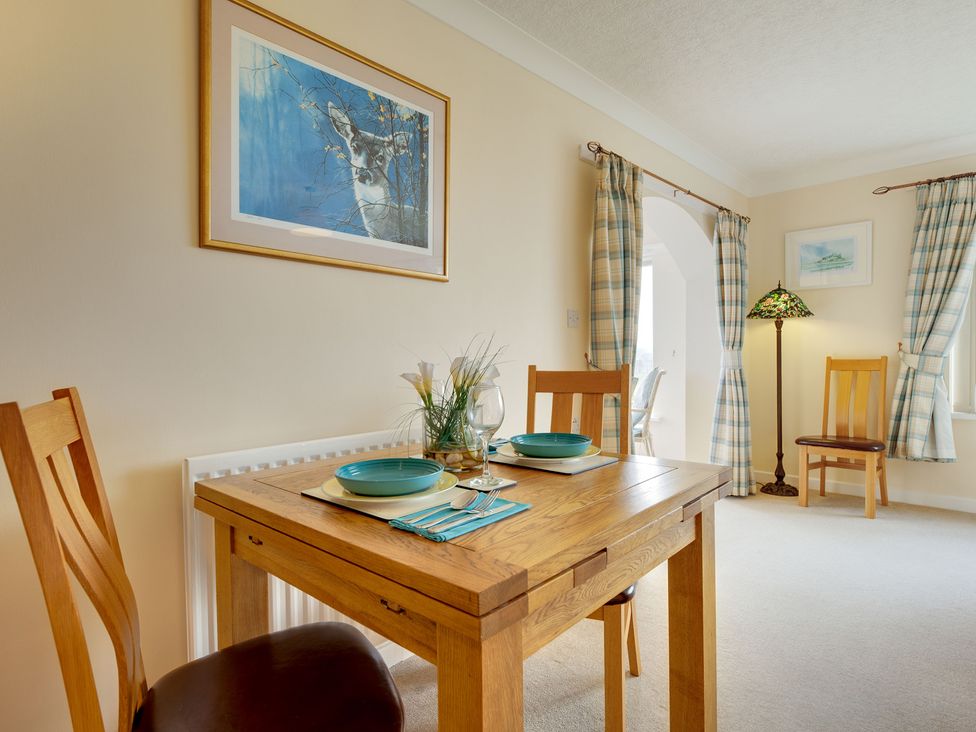 A dining room with a table set for two at The Granary in Alnwick