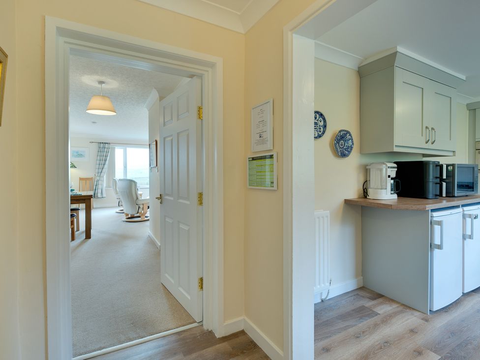 A view from a hallway into a kitchen area at The Granary in Alnwick