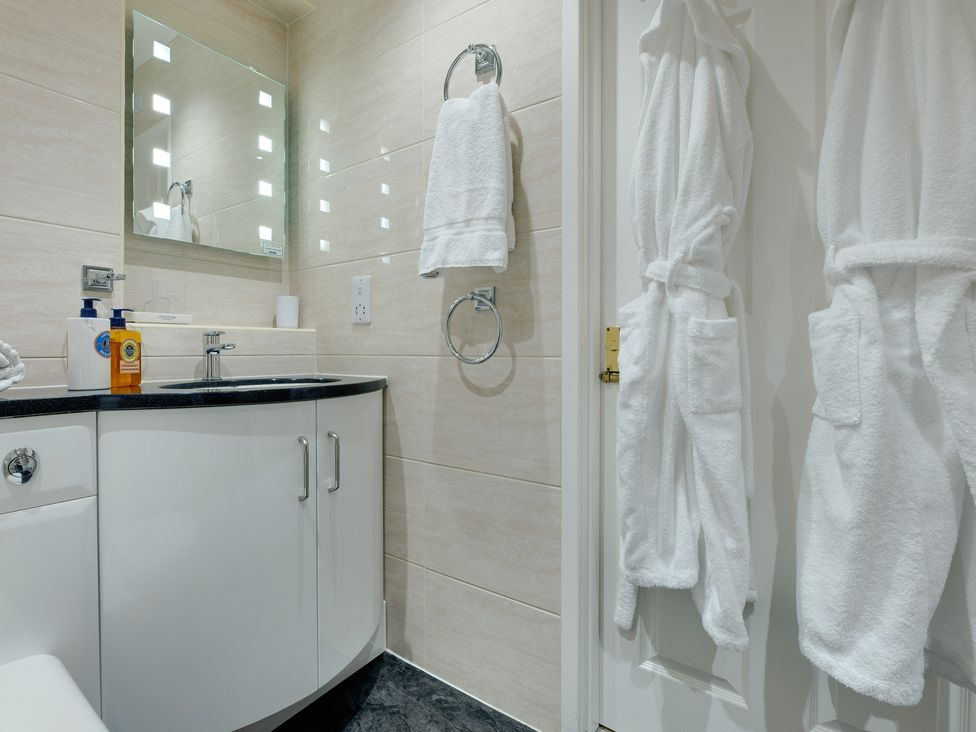 A bathroom with a sink and a mirror at The Granary in Alnwick