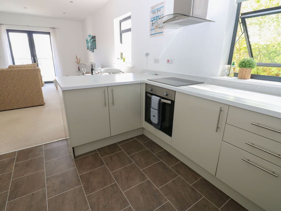 A kitchen with a stove and cabinets at Seaview in Whitehaven