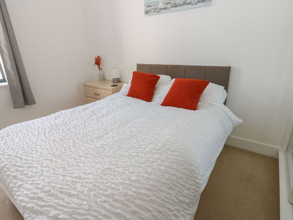 A bedroom with a bed and bedside table at Seaview in Whitehaven