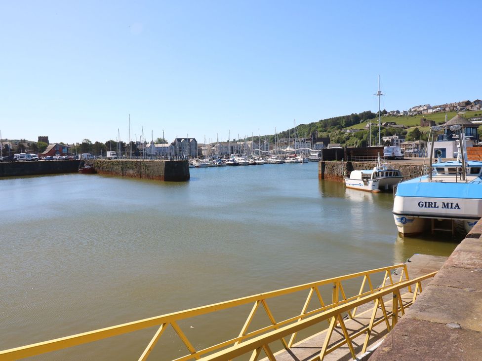 A harbor with boats in the water and buildings in the background at Seaview in Whitehaven