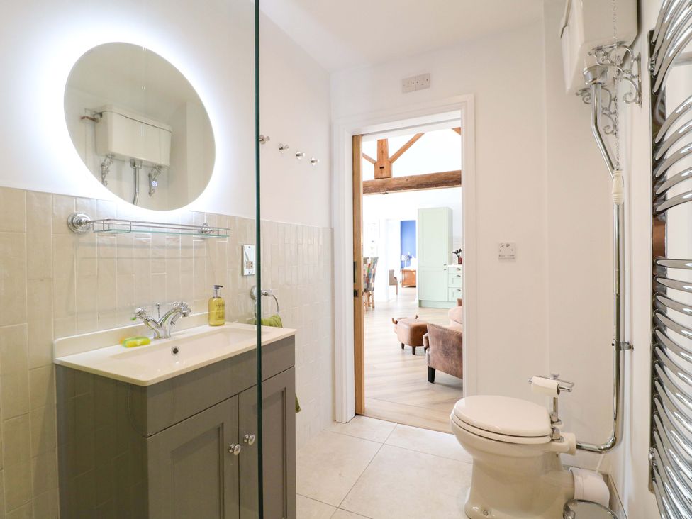 A bathroom with a sink and toilet at The Canalside Cottage in Derby