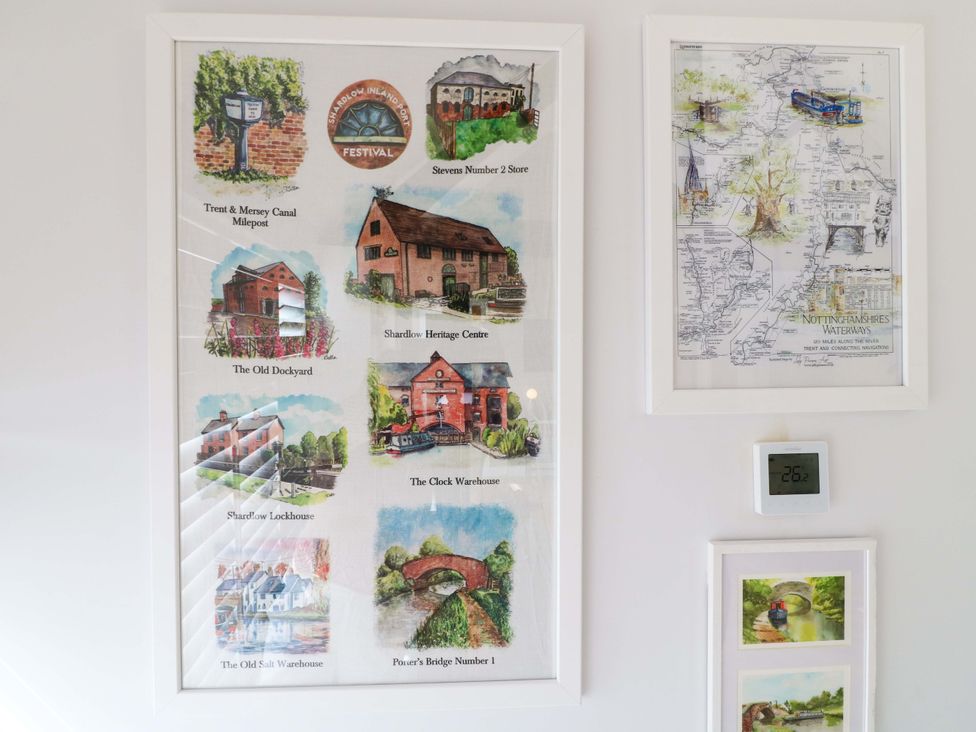 Framed artworks and thermostat at The Canalside Cottage in Derby