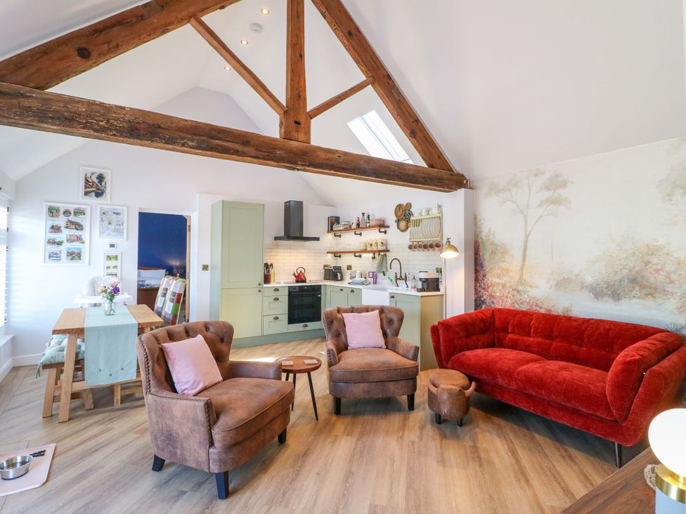 A living room with a sofa and armchairs at The Canalside Cottage Shardlow near Castle Donington