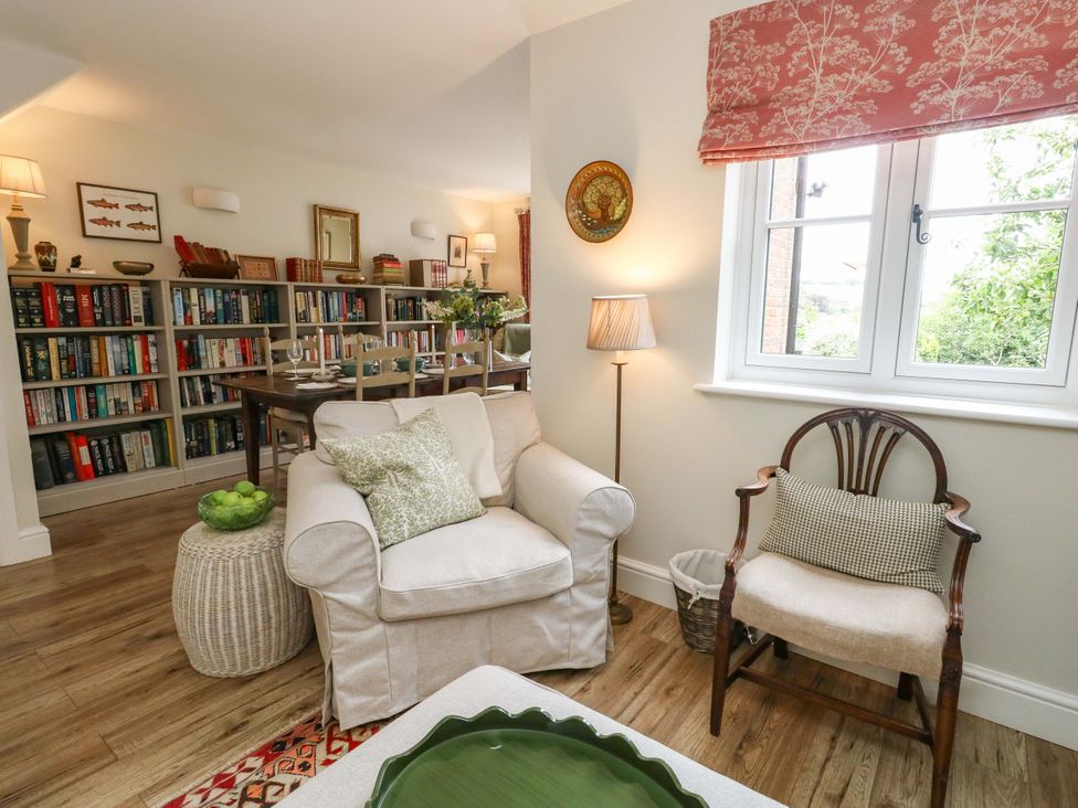 A snug with a sofa and bookshelf at 31 Bull Lane Dorchester