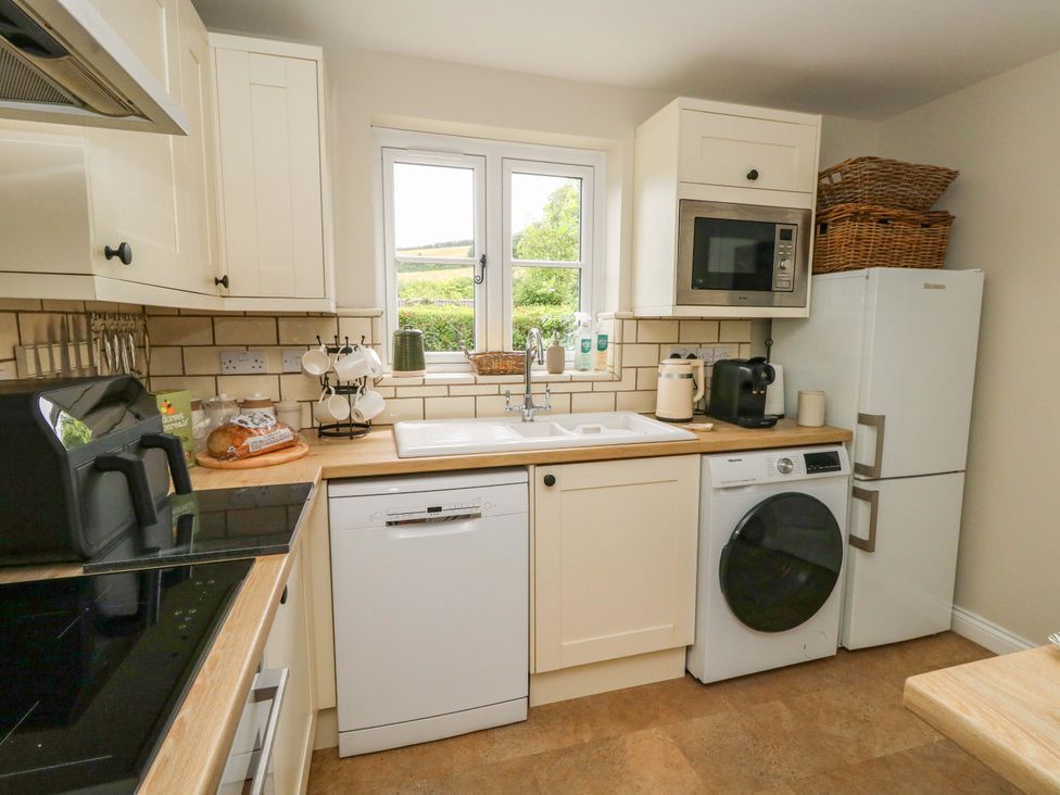A kitchen with sink and appliances at 31 Bull Lane in Dorchester