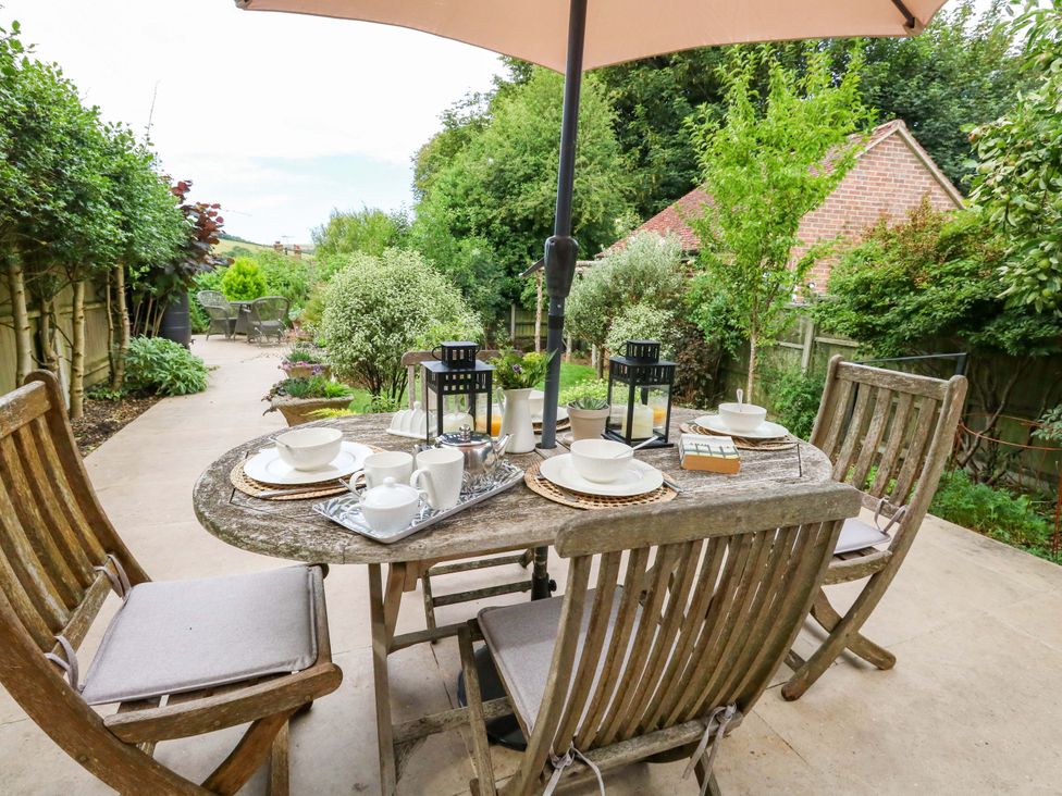 A garden with a table and chairs set for tea at 31 Bull Lane in Dorchester