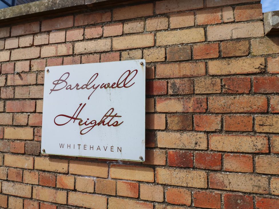 A sign on a brick wall at Bardywell Heights in Whitehaven