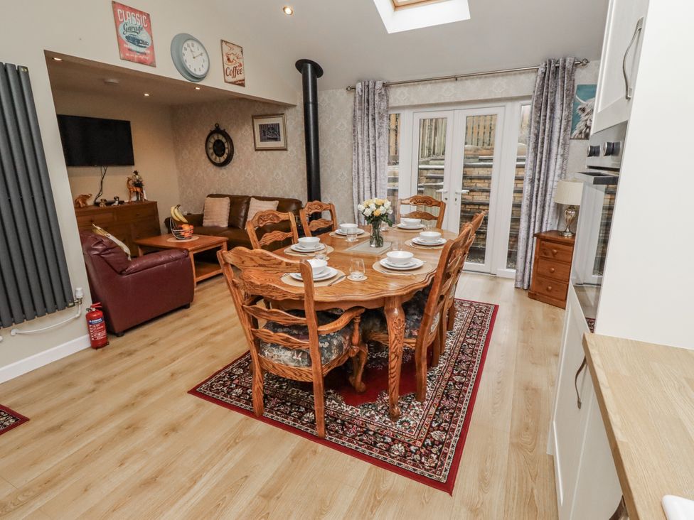 A dining room with a table and chairs at 26 Blakelaw Court in Alnwick
