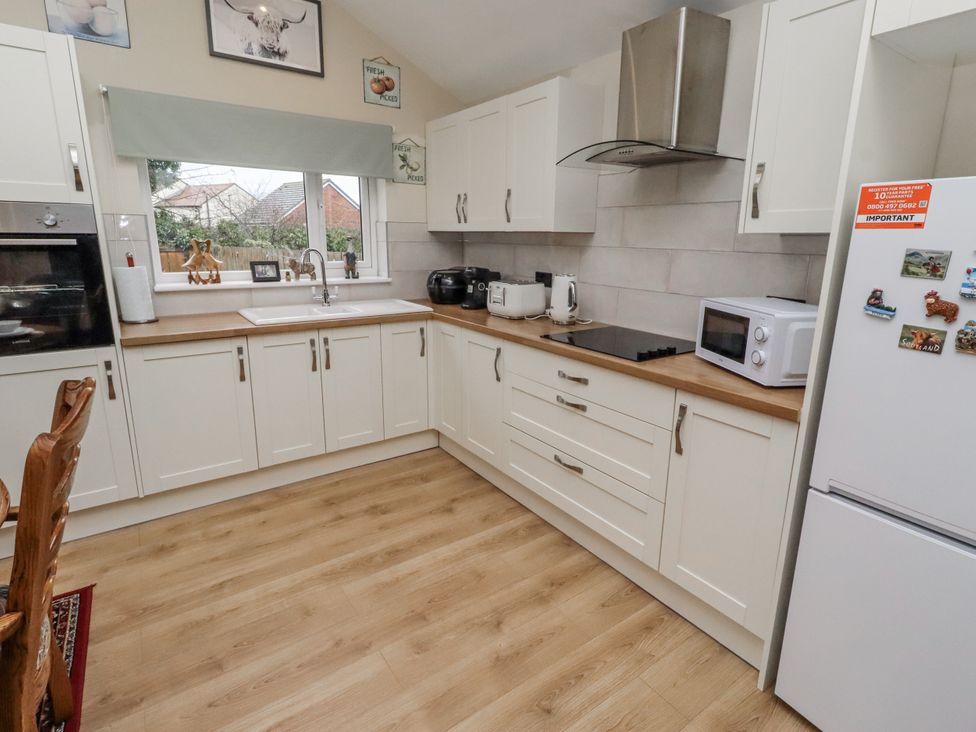 A kitchen with sink and appliances at 26 Blakelaw Court in Alnwick