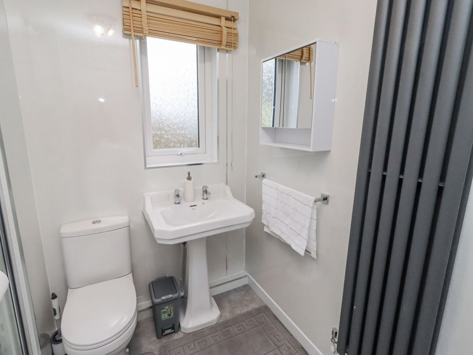 A bathroom with sink and toilet at 26 Blakelaw Court in Alnwick