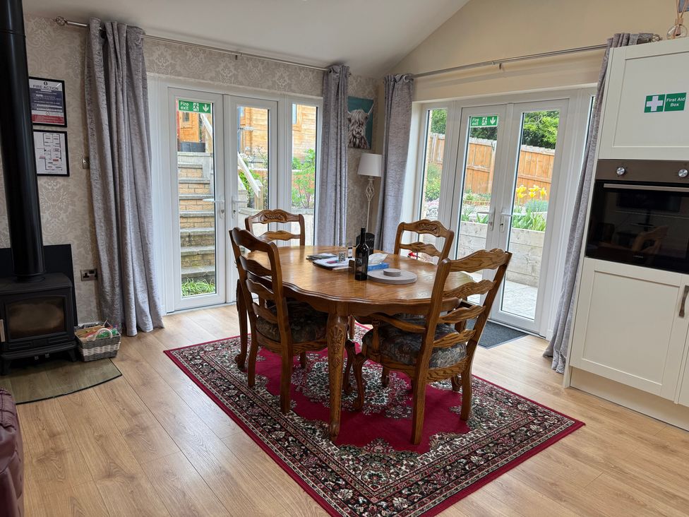 A dining room with a table and chairs at Blakelaw Court in Alnwick