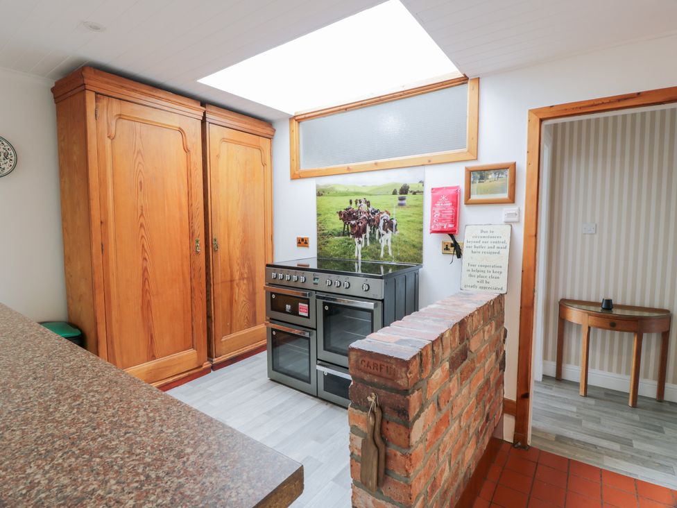 A kitchen with cupboards and an oven at Marshill Farm house in Lanark