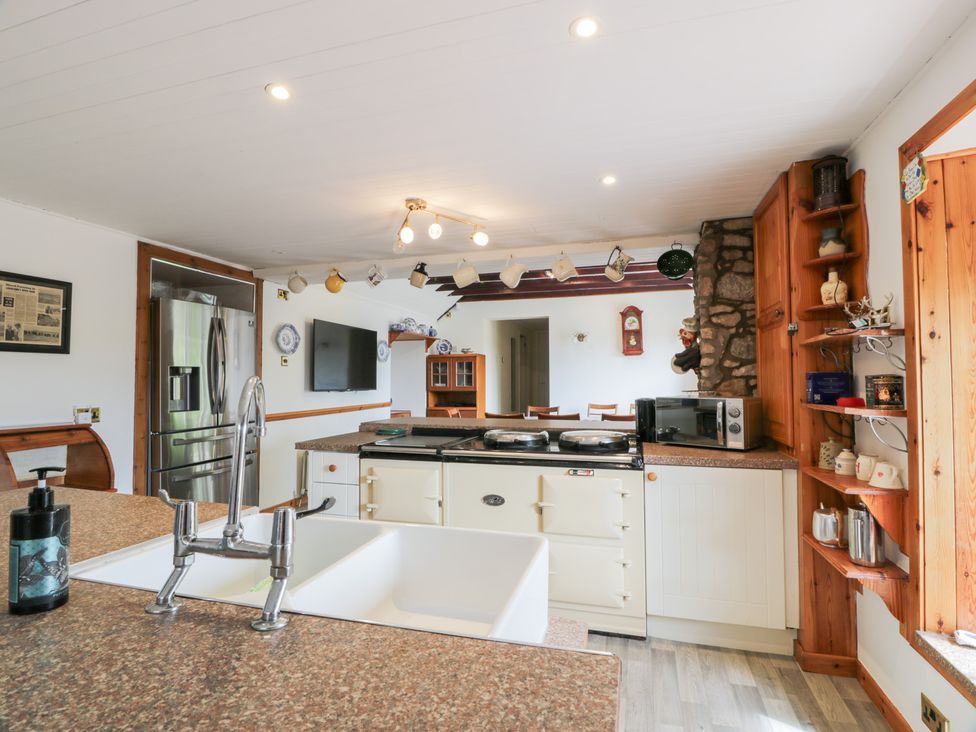 A kitchen with a refrigerator and stove at Marshill Farm house Lanark