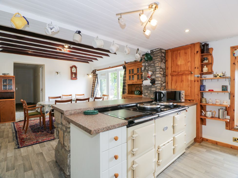A kitchen with an island and appliances at Marshill Farm house in Lanark