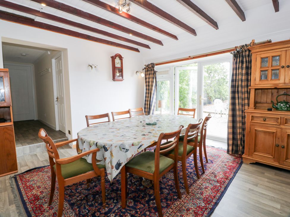 A dining room with a table and chairs at Marshill Farm house in Lanark