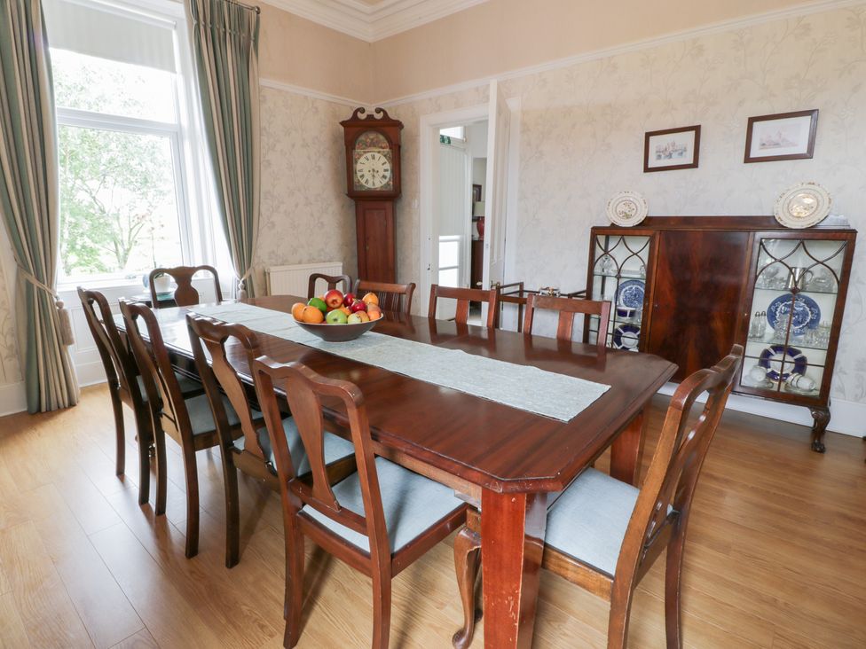 A dining room with a table and chairs at Marshill Farm house in Lanark