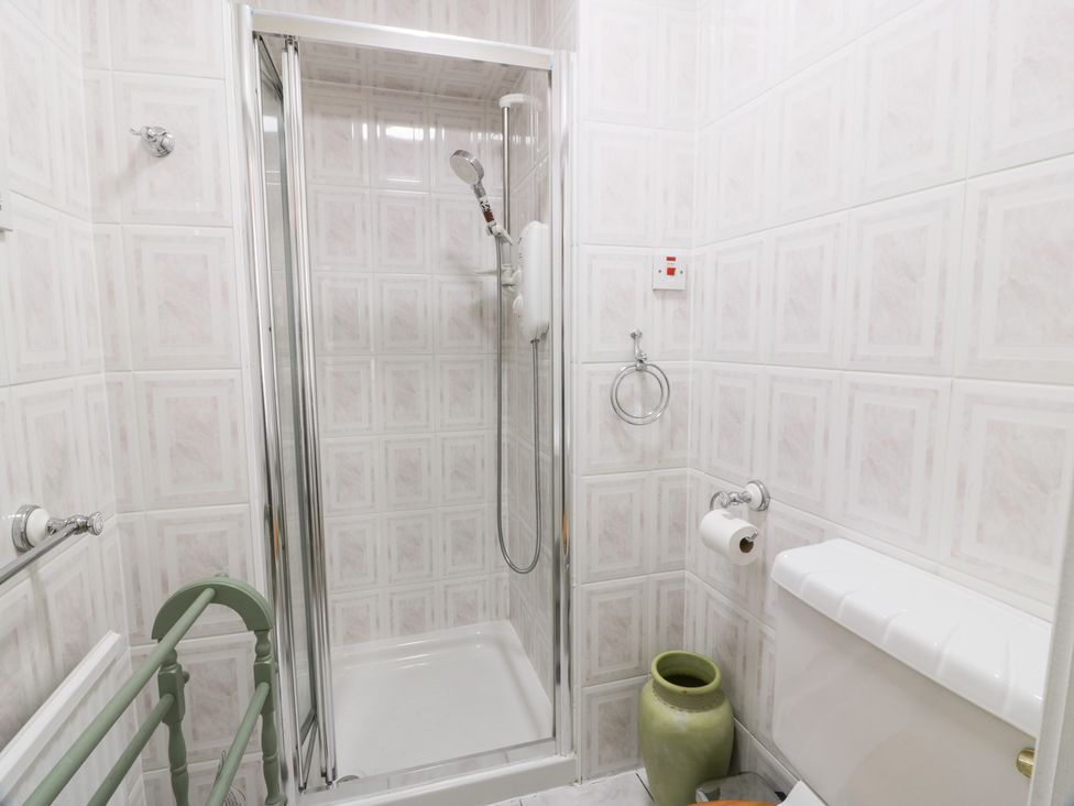 A bathroom with a shower and toilet at Marshill Farm house in Lanark