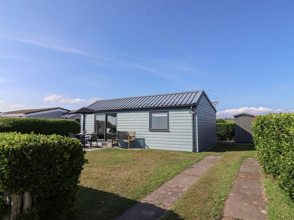 An outdoor view of a house with a garden at Stella Maris in Torpoint