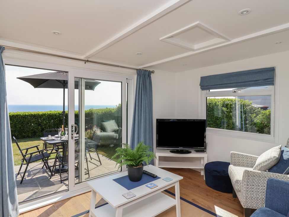 A living room with an outdoor view at Stella Maris in Torpoint