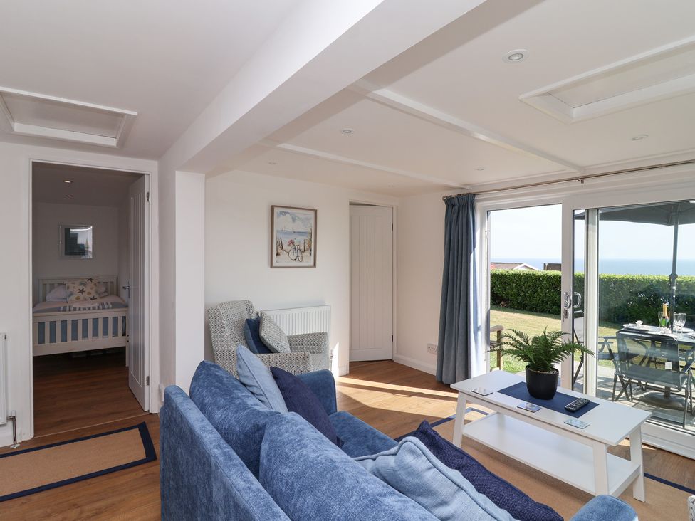 A living room with a sofa and coffee table at Stella Maris in Torpoint