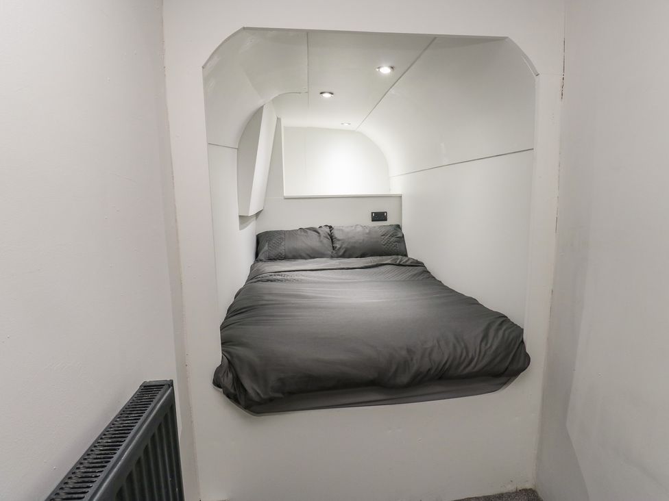 A bedroom with a built-in bed at Myrtle Nook in Keighley