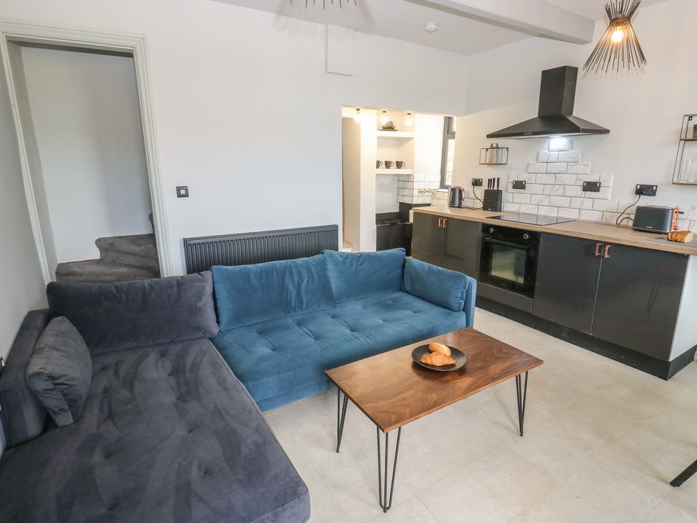 A living room with a sofa and coffee table at Myrtle Vista in Keighley