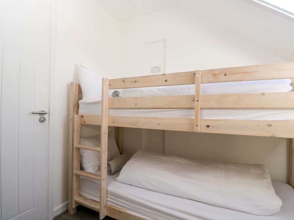 A bunk bed in a bedroom at Barn Cottage in Frome
