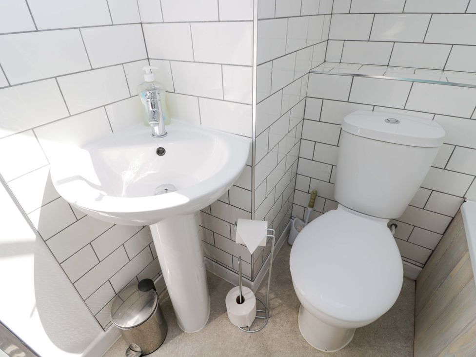 A bathroom with a sink and toilet at Barn Cottage in Frome
