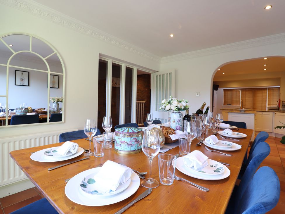 A dining room with a table set for a meal at Forest Getaway