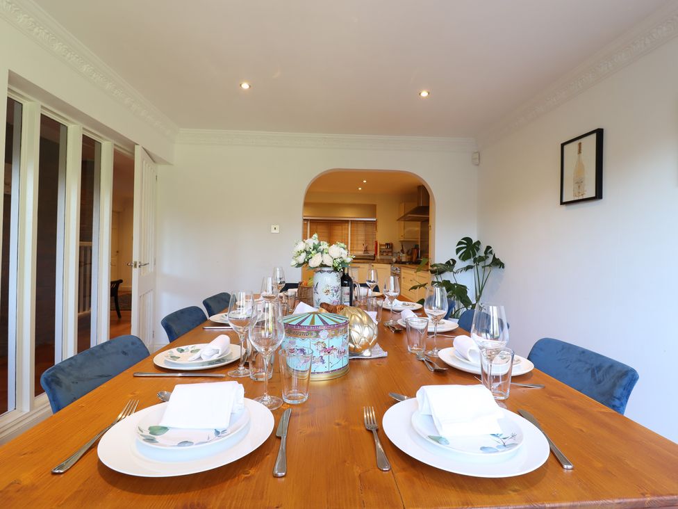 A dining room with a table set for dinner at Forest Getaway