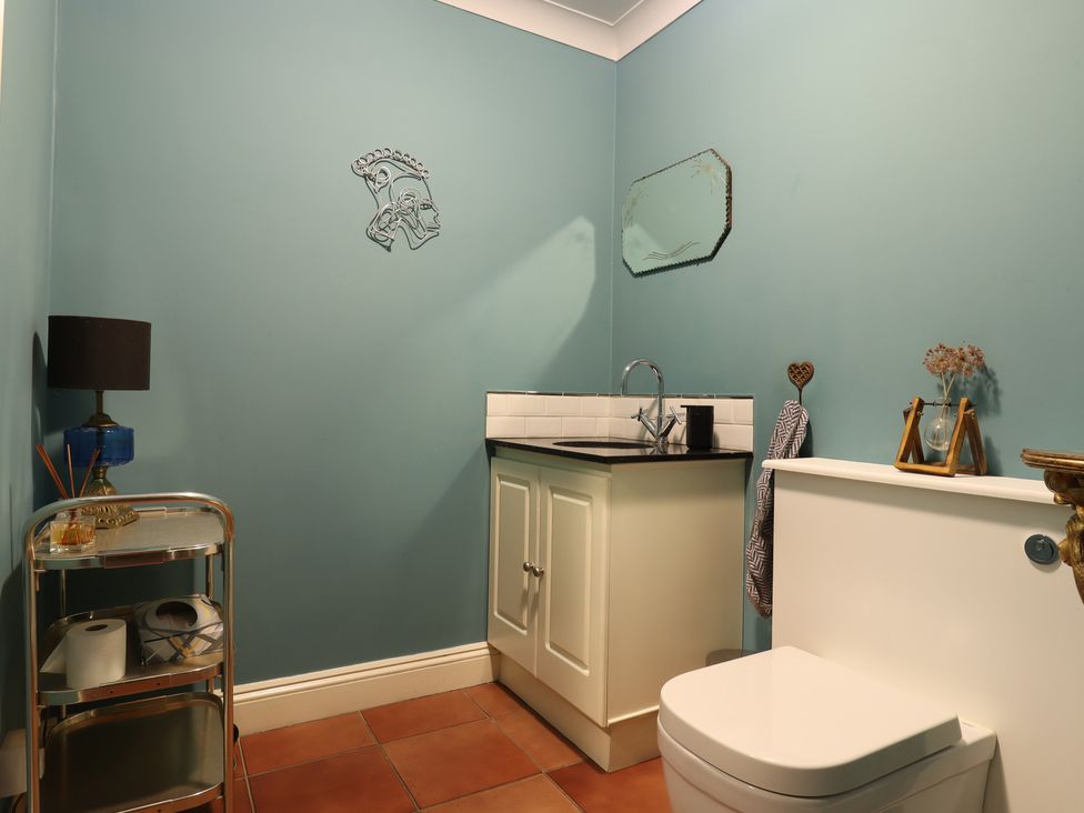 A bathroom with a sink and toilet at Forest Getaway