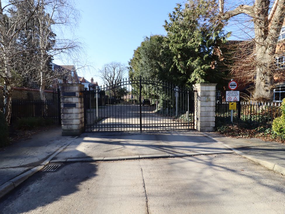 A gated entrance with a driveway at Forest Getaway