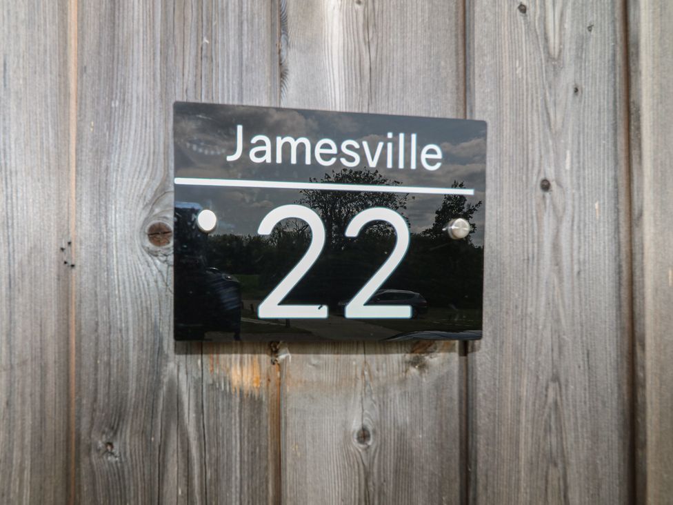 A sign with Jamesville 22 at James Ville Marina Lodge 22 in Brigg