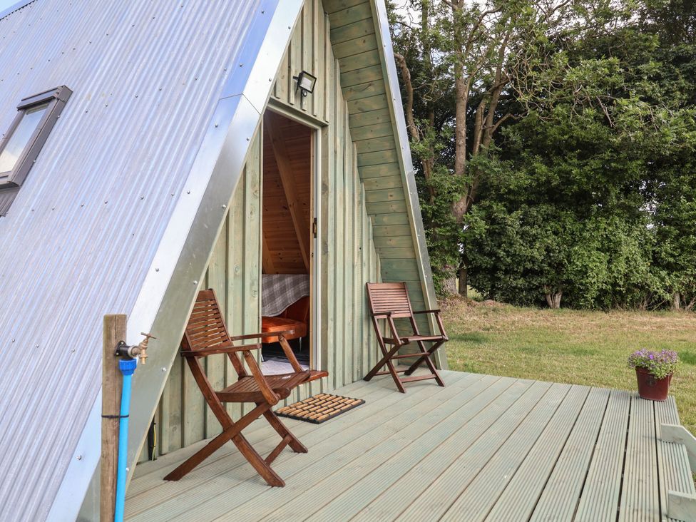 An outdoor space with chairs and a door at Robin in Monewden near Otley, Suffolk