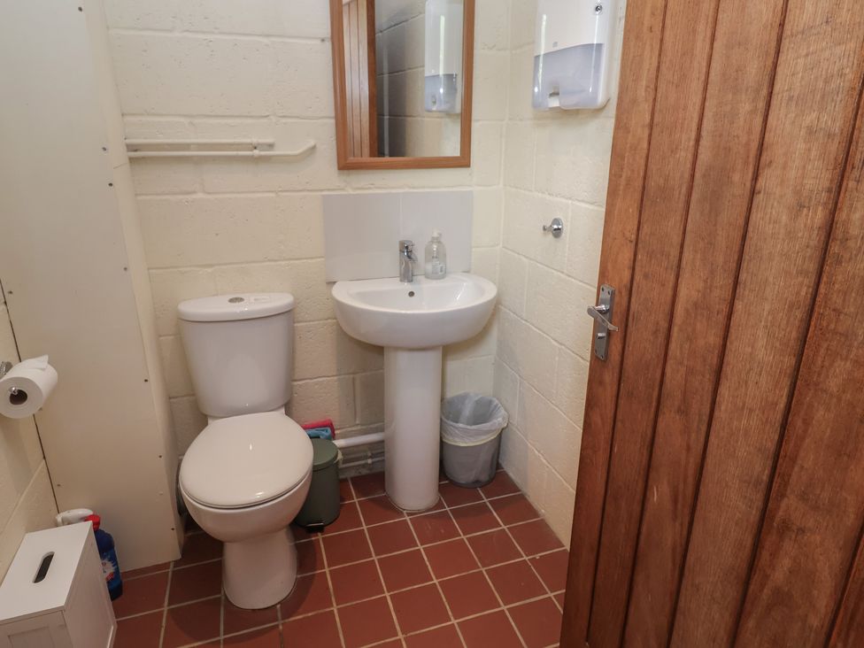 A bathroom with a sink and toilet at Robin in Monewden near Otley, Suffolk