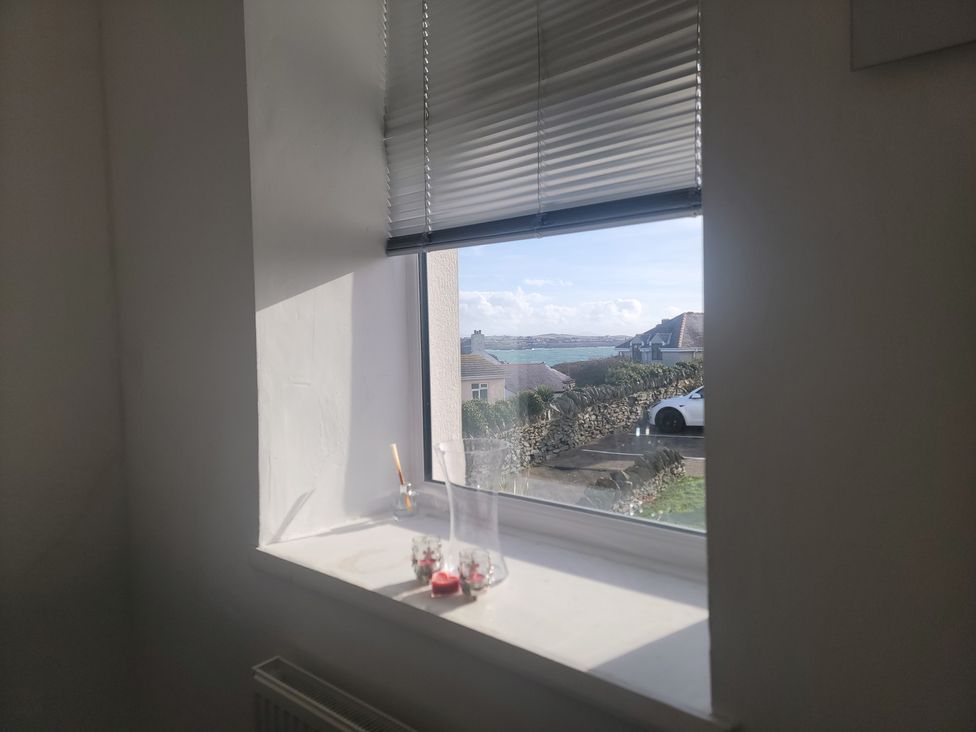 A window with a view in the living room at Plas Darien no 28 Trearddur Bay