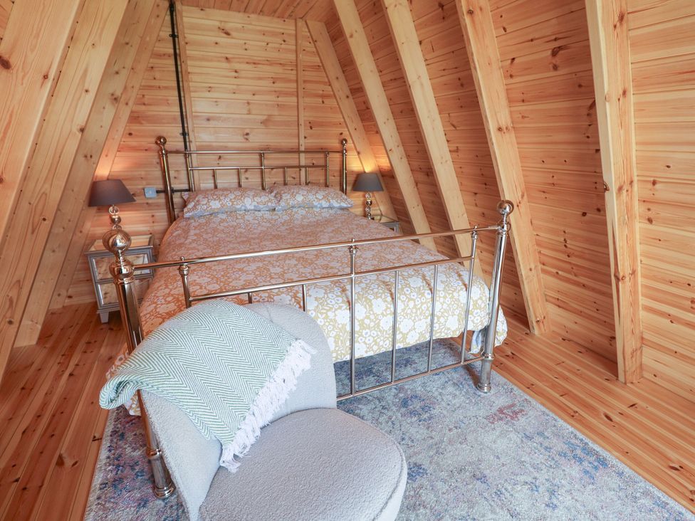 A bedroom with a bed and lamp at 1 Bed Sleeps 2, Shared Bathroom Monewden near Otley, Suffolk