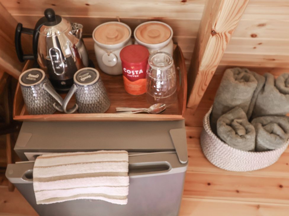 A kitchen setup with coffee and towels at 1 Bed Sleeps 2, Shared Bathroom in Monewden near Otley, Suffolk