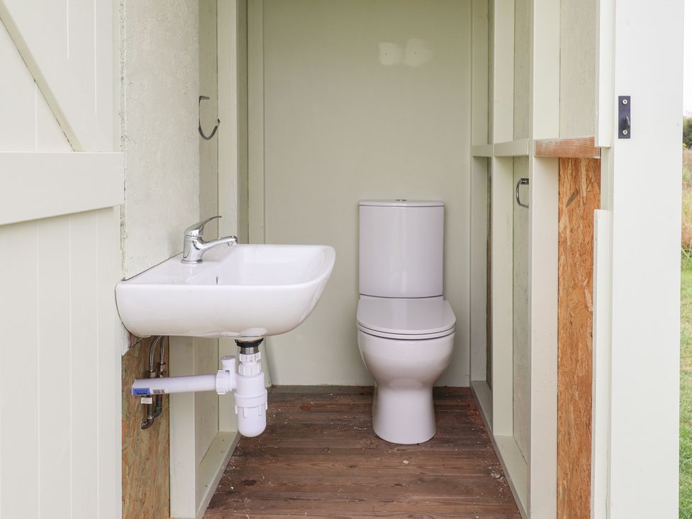 A bathroom with a sink and toilet at Oak Tree in Monewden near Otley, Suffolk