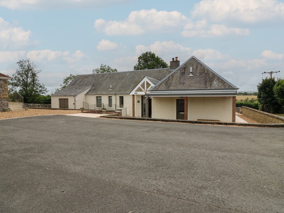 A house with a garage and driveway at Lower Lodge in Cupar