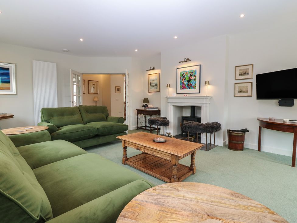 A living room with a sofa and a coffee table at Lower Lodge in Cupar