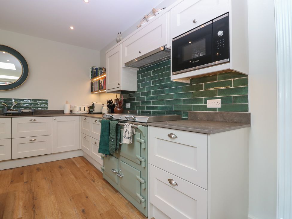 A kitchen with cabinets and an oven at Lower Lodge in Cupar
