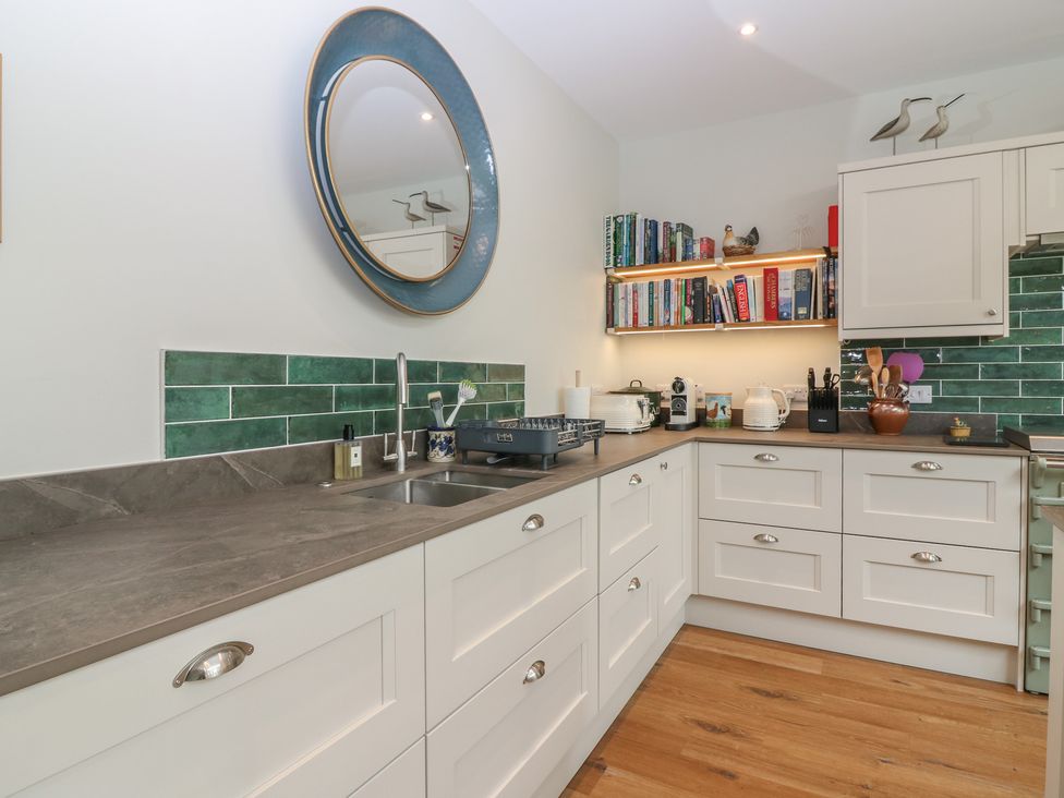 A kitchen with cabinets and a sink at Lower Lodge in Cupar