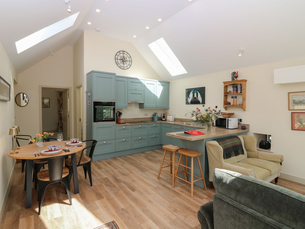 A kitchen with a table and chairs at The Barn, Lower Lodge in Cupar